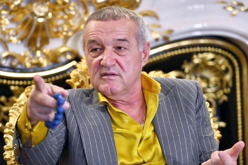 Un bărbat s-a urcat pe un stâlp și a cerut o casă de la Gigi Becali