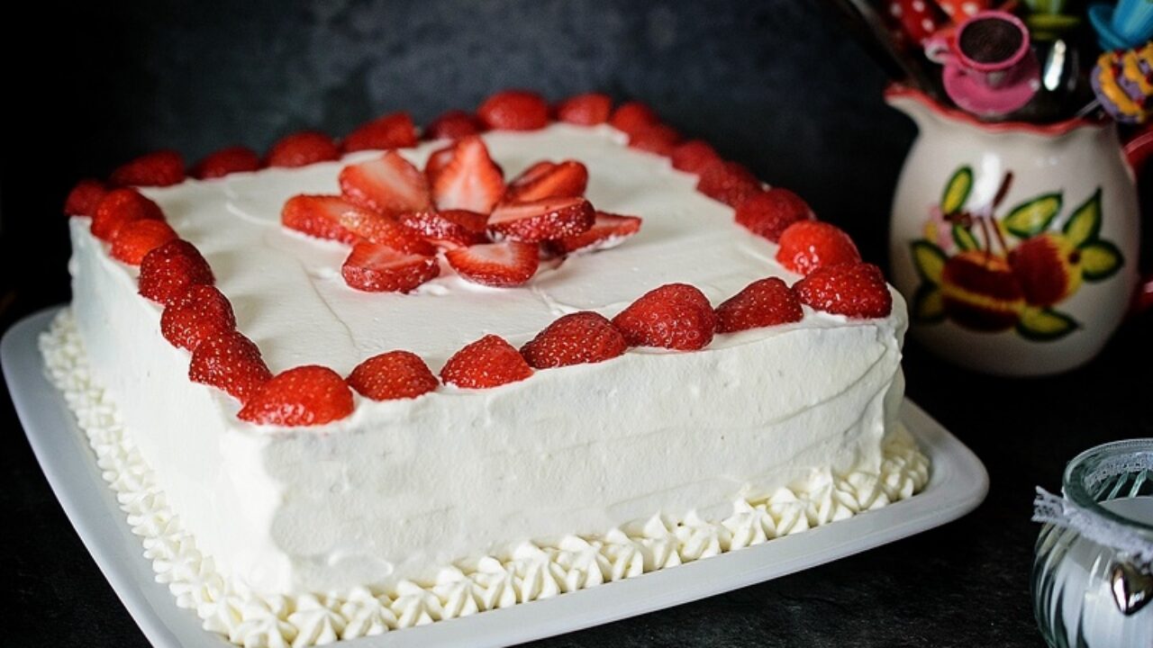 cake with whipped cream and strawberries