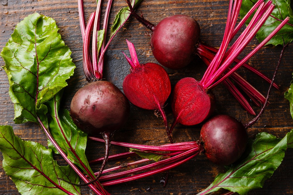 Several pieces of fresh beets on the table