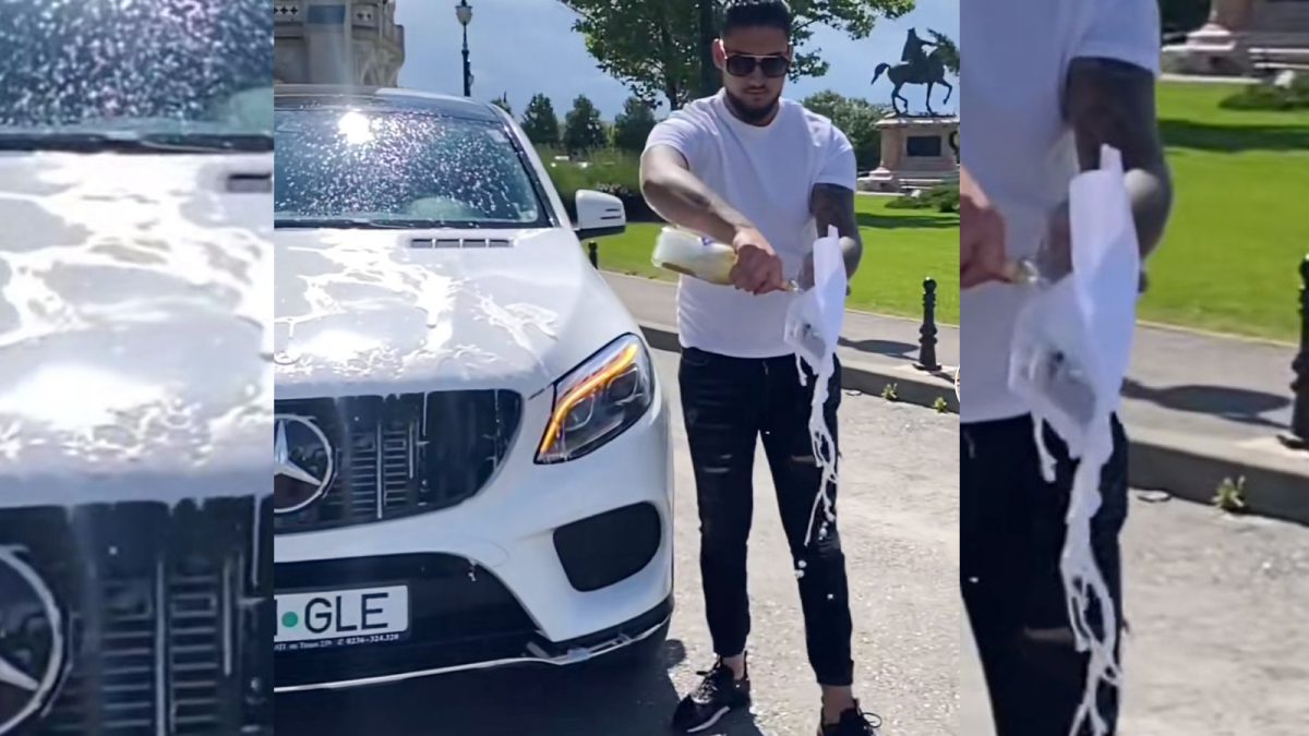 Scene incredibile! Iată cum se sărbătorește, la Iași, obținerea permisului auto! Un tânăr și-a stropit Mercedes-ul cu vin spumant în fața Palatului Culturii – FOTO/VIDEO